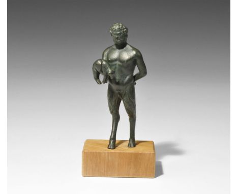 ". An undated archaistic bronze figurine of the god Pan in 2nd century AD style, standing with left hand behind his back, rig