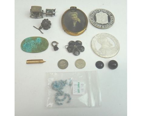 An unmounted oval turquoise matrix cameo, carved as a row of four standing classical female figures, a sulphide and colourles