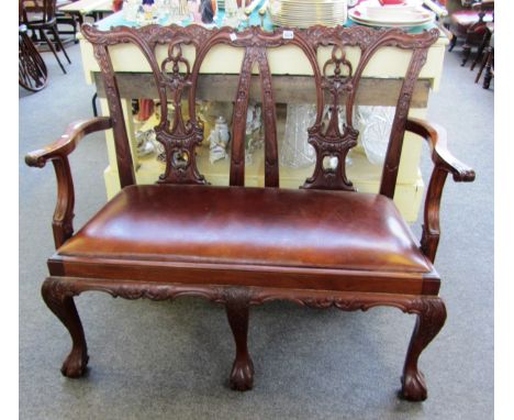 A Chippendale design mahogany double chair back sofa on claw and ball feet, 120cm wide.