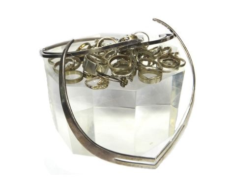 Mostly silver jewellery, comprising; a Mexican collar necklace, with a matching bangle, a collar necklace in an angular desig