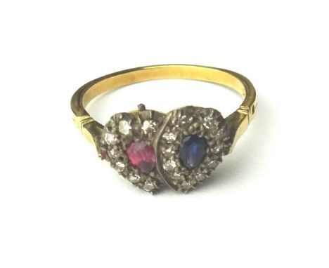 A gold, diamond, ruby and sapphire set ring, in a twin heart shaped design, mounted with ruby and sapphire set centre stones 