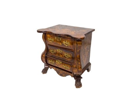 An early 19th century and later Dutch marquetry inlaid bombe three drawer commode on lions paw feet, 78cm wide. 