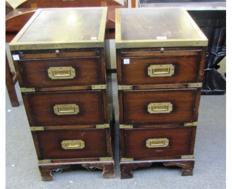 A pair of 20th century brass bound campaign style pedestals of three drawers on bracket feet, 31cm wide. 
