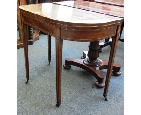 A George III crossbanded mahogany 'D' shaped card table on tapering square supports, 91cm wide. 