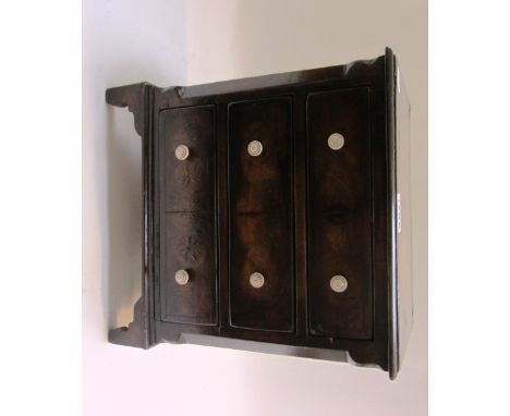 A miniature mid 18th century style chest of three long drawers, on bracket feet, 26cm wide.