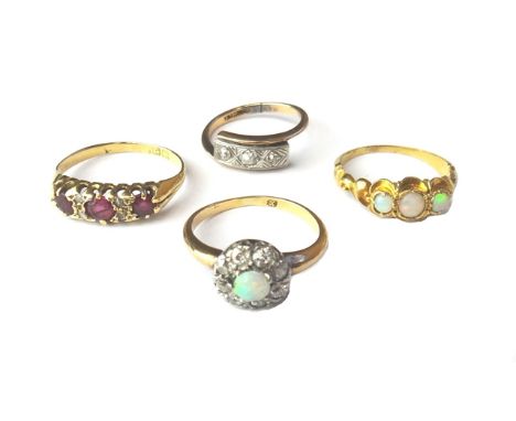 A gold, opal and diamond set nine stone cluster ring, a gold and opal set three stone ring, an 18ct gold, ruby and rose diamo