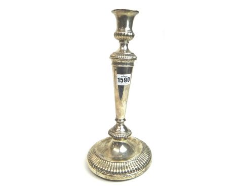 One silver table candlestick, decorated with fluted bands and with a tapering column, on a circular base, Sheffield 1805, the