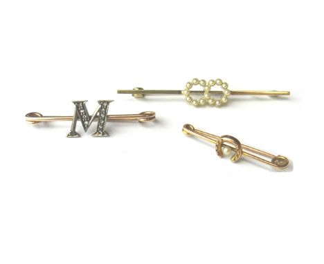 A diamond set bar brooch, with an initial M motif, a gold and seed pearl set bar brooch, in a twin circular design and a seed