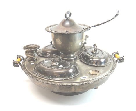 A plated large circular twin handled rotating Lazy Susan, the centre with a lidded soup tureen, with a soup ladle, three oval