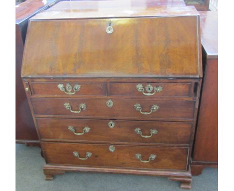 A George III mahogany bureau with two short and three long graduated drawers, on ogee bracket feet, 96cm wide.