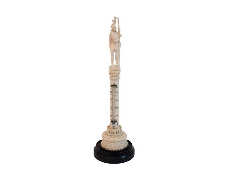 A carved ivory thermometer, early 20th century, with figural knight finial over a circular carved Corinthian column on an ebo