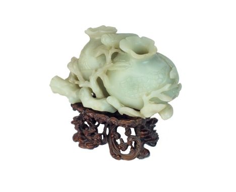 A Chinese pale celadon jade pomegranate and cicada vase, 19th century, carved as two pomegranates on a leafy branch, a cicada