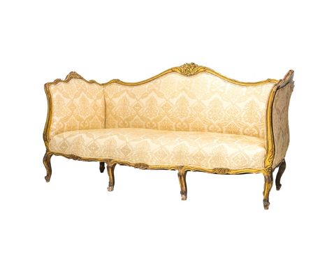 A Louis XV style gilt framed sofa on six scroll supports, 205cm wide. 