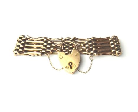 A gold bar and oval link gate bracelet, detailed 9 CT, on a gold heart shaped padlock clasp, detailed 9 CT, weight 19.5 gms.