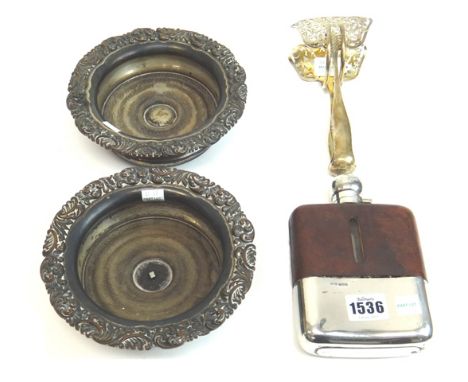 A silver and brown leather mounted curved rectangular glass spirit flask, Sheffield 1937, a pair of French asparagus serving 