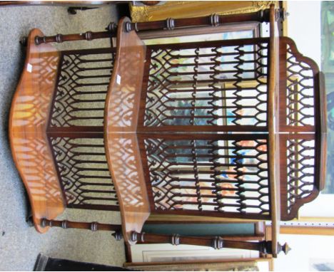 A 19th century fret cut walnut angular hanging three tier wall shelf, 55cm wide. 