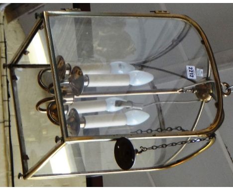 A Victorian gilt brass hall lantern of square section, the globular finial united by four curved stretchers on ball finials, 