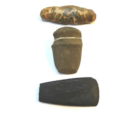 A North American Indian stone axe head (11cm), a Neolithic flint hand axe and a black basalt axe head, (3).