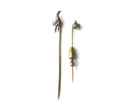 A rose diamond set stick pin, designed as a standing cockerel, with a cabochon red gem set eye and a rose diamond set stick p