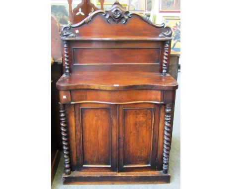 A Victorian mahogany shelf back serpentine chiffonier with barley-twist decoration, 88cm wide.  