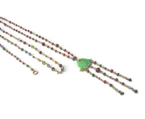 A gold, carved jade, ruby, sapphire and emerald pendant necklace, the front with three gem set pendant chains from a carved j