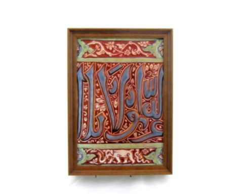 A Nasrid-style calligraphic pottery tile, probably Cantagalli, Italy, late 19th century, moulded with blue kufic characters a