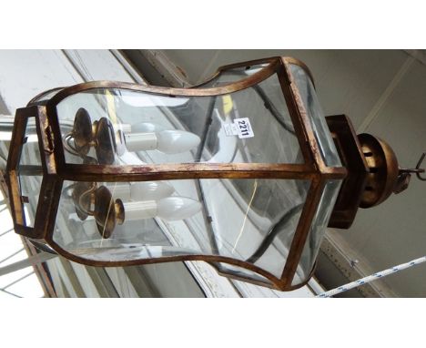 A modern gilt metal hexagonal hall lantern of curved tapering form, 65cm high. 