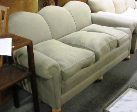 A mid 20th century grey upholstered triple hump-backed sofa, 190cm wide.