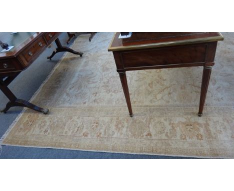 A Persian carpet of Tabriz design, modern, the beige field with an allover design of bold angular flowering vines, a compleme
