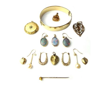 A gilt metal oval hinged bangle, on a snap clasp, a gold mounted oval opal doublet set pendant, a pair of oval opal triplet s