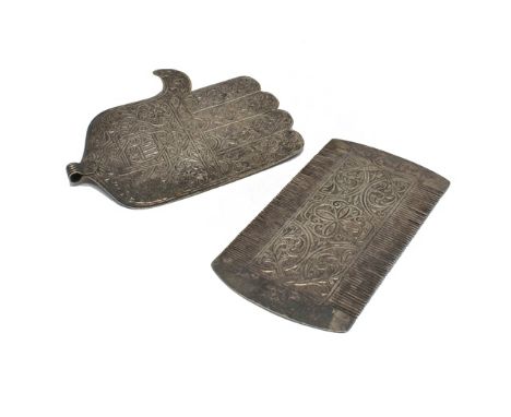 An Eastern rectangular twin edged comb, the central panels to either side with engraved decoration, possibly Turkish and a la