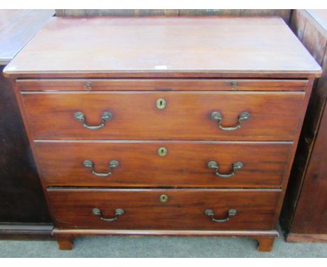 A George III mahogany chest of three long graduated drawers on bracket feet, 90cm wide.