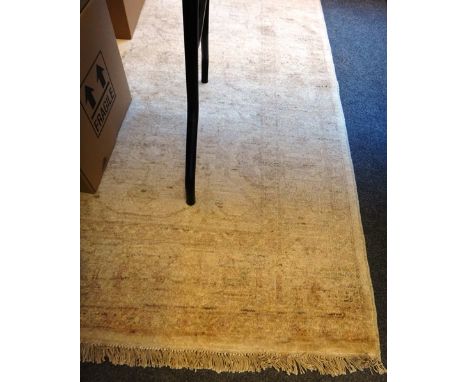 A Persian carpet of Tabriz design, modern, the beige field with an allover palmette and vine design, with a complementary bor