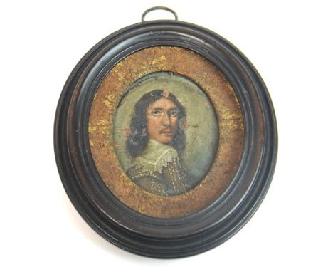 17th century Continental School, Portrait miniature of a young man, with Cavalier long hair, green coat with white lace colla