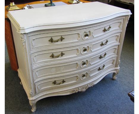 A Louis XV style painted serpentine three drawer commode on scroll feet, 115cm wide.
