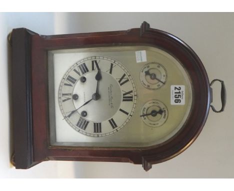 A mahogany cased mantel clock, early 20th century, with domed case and silvered dial detailed 'Camerer, Cuss & Co, 56 New Oxf