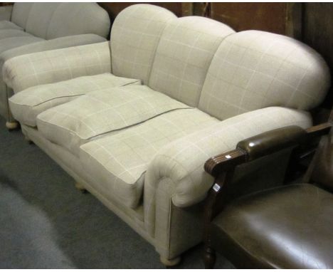 A mid 20th century light tweed upholstered triple hump-backed sofa, 195cm wide.
