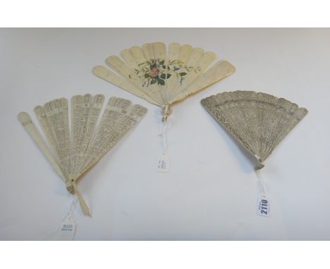 A Chinese carved ivory fan, 19th century, intricately carved with Oriental scenes with a central medallion, the stick guards 