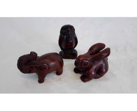 Three wooden netsuke style animals 