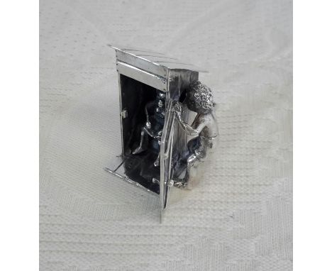A Dutch silver peeping Tom item. 4cm in height
