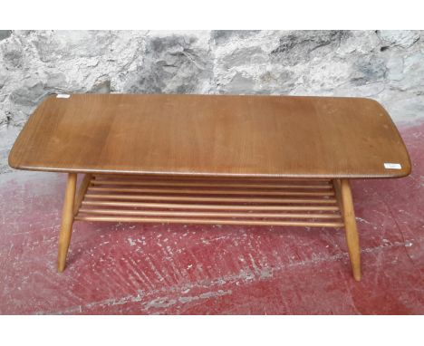 An ercol elm wood coffee table, 36x106x46cm 