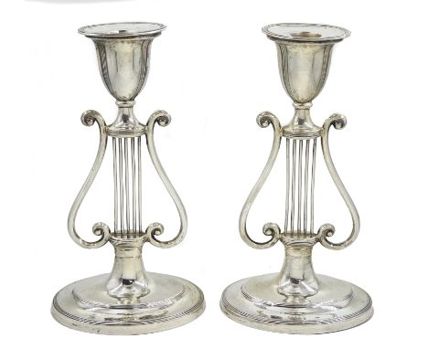 Pair of Edwardian silver stylized harp candlesticks by Sibray, Hall & Co Ltd, London 1911, H19.5cm Condition Report Weigh on 