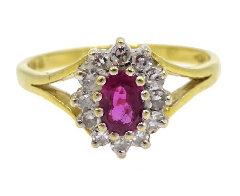 18ct gold oval ruby and round brilliant cut diamond cluster ring, hallmarked Condition Report Click here for further images, 