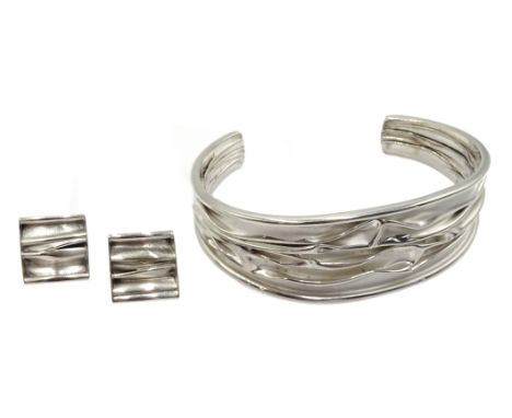 Silver contemporary design bangle and matching earrings, stamped 925 Condition Report Click here for further images, conditio