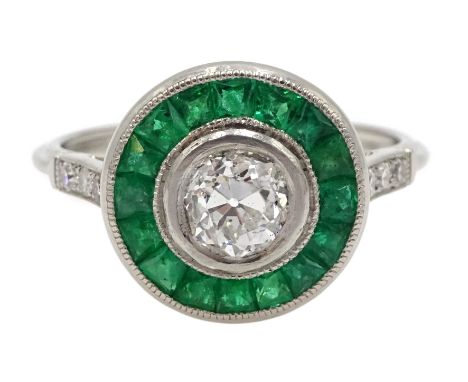 Platinum old cut diamond and calibre cut emerald target ring, with diamond set shoulders, central diamond approx 0.65 carat[i