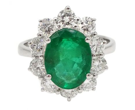 White gold oval emerald and round brilliant cut diamond ring, stamped 750, emerald approx 2.80 carat, diamond total weight ap