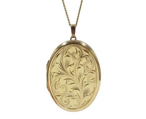Gold locket pendant, engraved decoration on the front, engine turned decoration on the reverse hallmarked 9ct, on gold chain 
