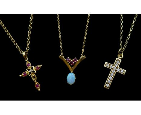 Gold opal and ruby wishbone necklace, gold ruby and diamond cross pendant necklace and cubic zirconia cross pendant necklace,