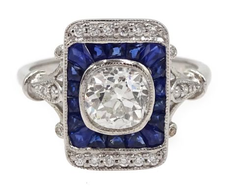 White gold cushion cut diamond, calibre cut sapphire ad diamond diamond panel ring, stamped 18K, the central diamond approx 0