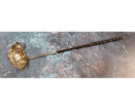 A George III silver double lipped toddy ladle, the bowl embossed with flowers, foliage and scrolls, wrythen whale bone handle